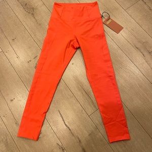 Neon orange girlfriend collective leggings. Size XS NWT